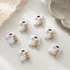 A white bear pendant holding a loaf of bread, a creative cartoon, cute and adorable necklace pendant, a gift accessory for girls and couples details Picture